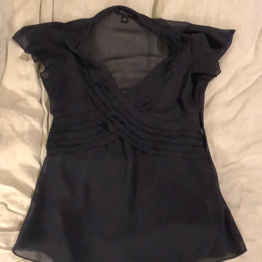 Navy blue dressy flutter sleeve top.